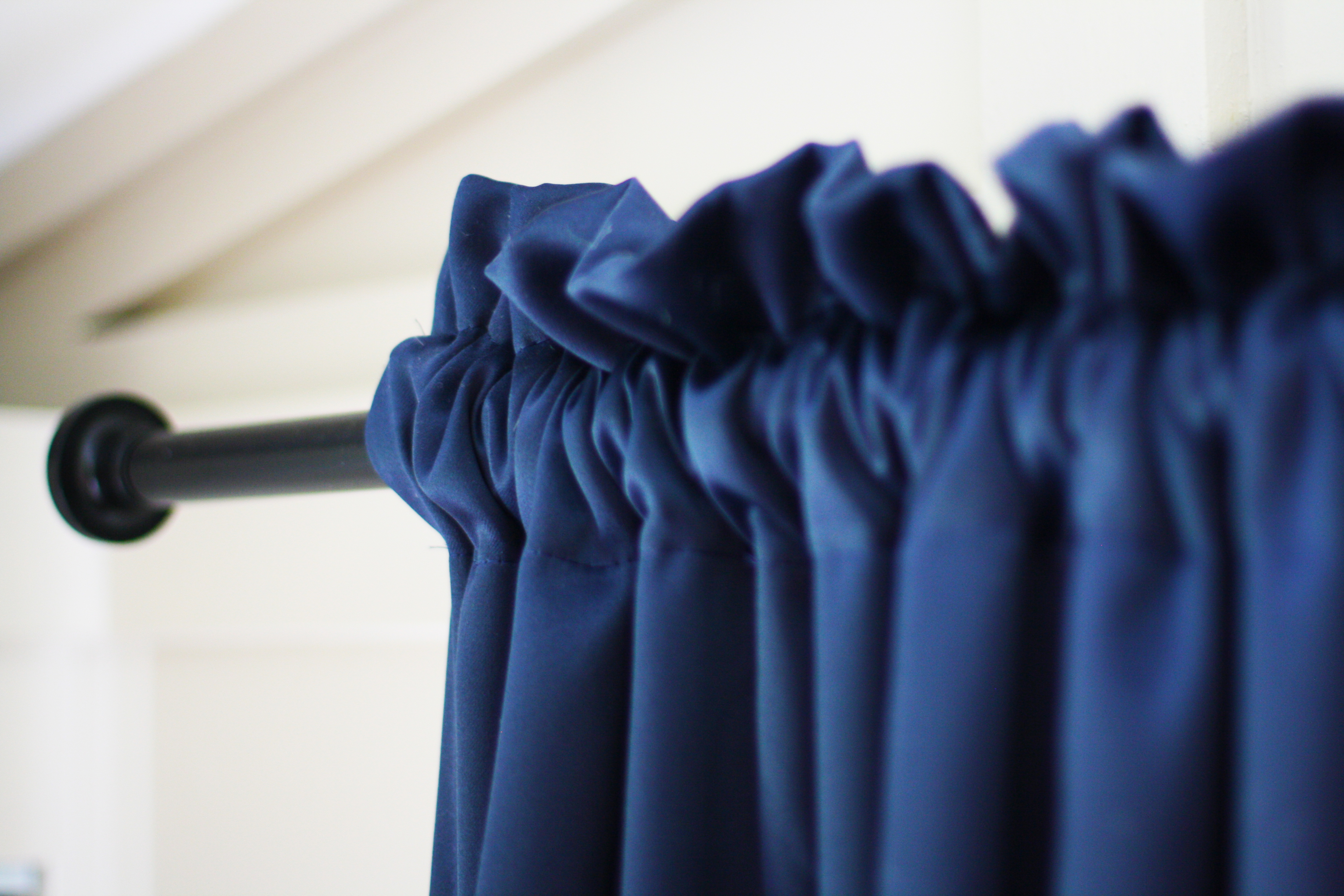 Blue curtain hanging on curtain rod | redleafstyle.com
